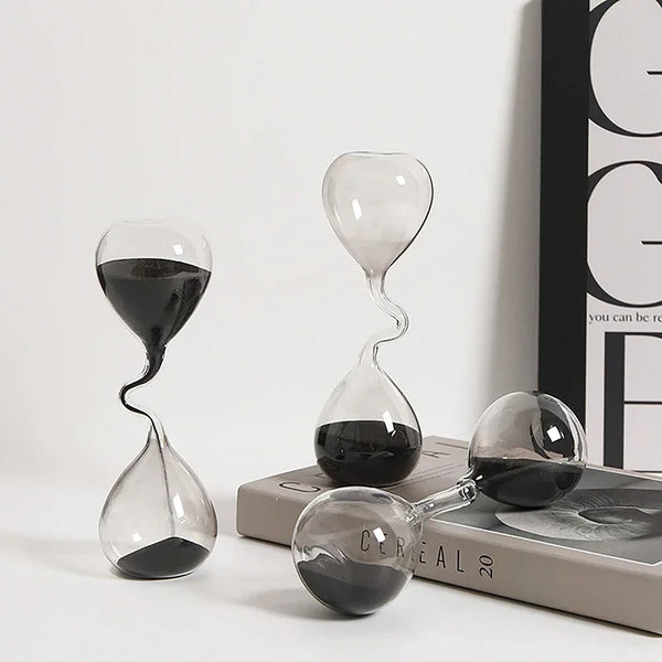 Hourglass curve design, black modern style, glass craftsmanship, simple indoor dining table decoration, beautiful sand clock