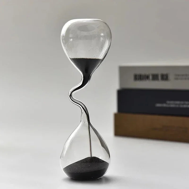 Hourglass curve design, black modern style, glass craftsmanship, simple indoor dining table decoration, beautiful sand clock